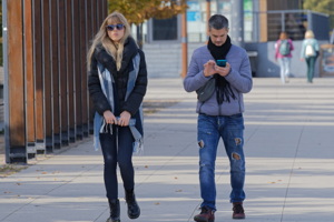 Young couple on sidewalk